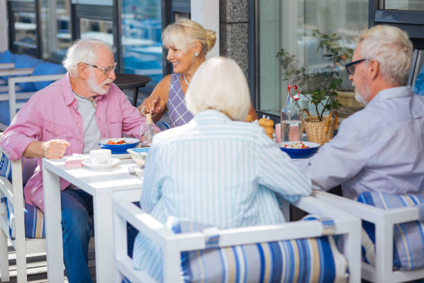 istock Delighted positive aged people meeting at lunch 1046635232
