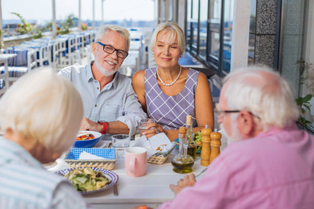 istock Nice aged friends meeting together for lunch 1046635318