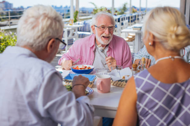 istock Nice aged man telling an interesting story 1046635350