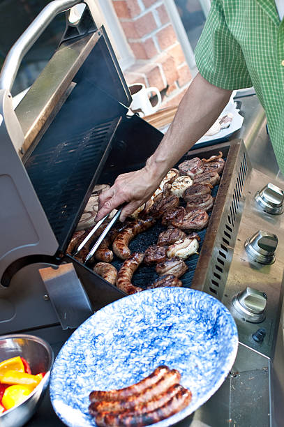 istock Man Grilling Meat on a Barbecue 104663618