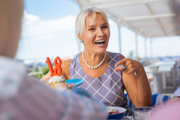 istock Joyful happy woman pointing at her friend 1046642626