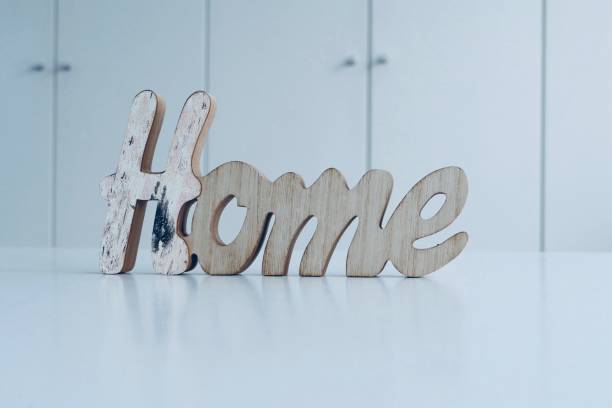 istock Word Home on the table in living room 1046646428