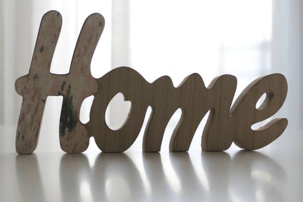 istock Word Home on the table in living room 1046646542