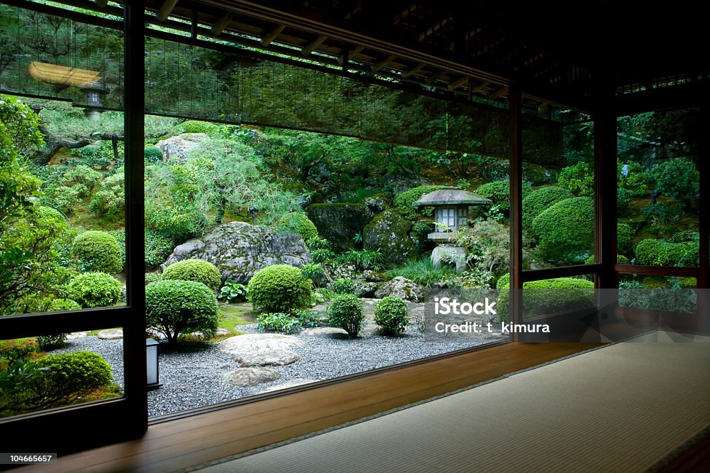 Japanese Room with a View Japanese garden seen from inside a traditional tatami room. Japanese Rock Garden Stock Photo