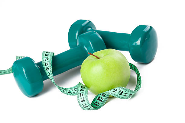 istock green dumbell and apple 104665734