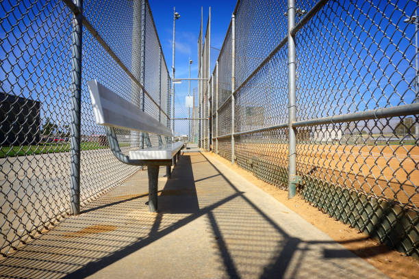 baseball dugout baseball dugout with empty bench baseball cage stock pictures, royalty-free photos & images