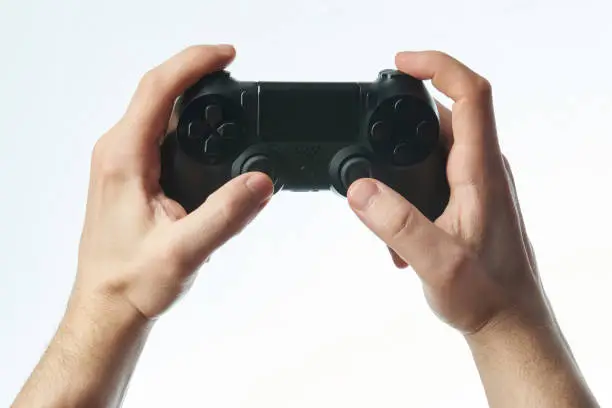 Photo of Black joystick in hands