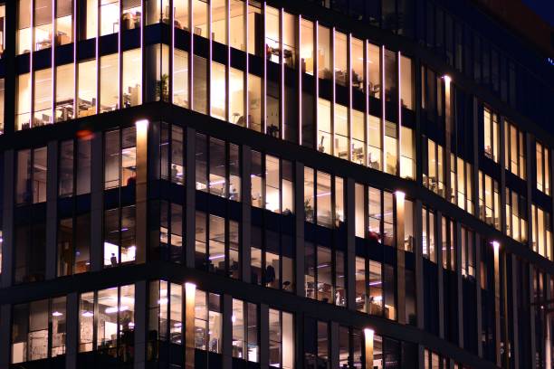 istock Office building at night. Late night at work. 1046663984