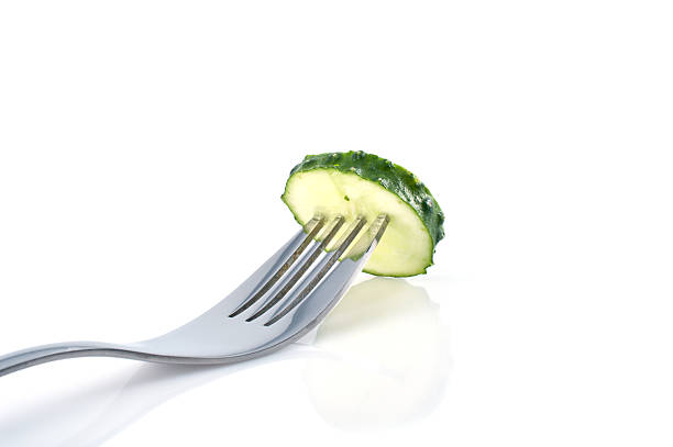 istock Piece of cucumber on the fork 104666864