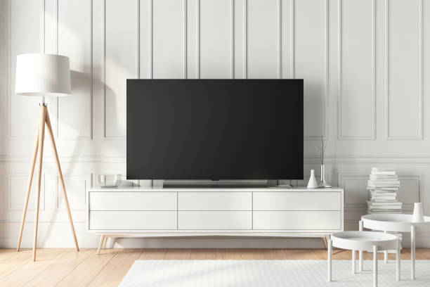 große moderne smart tv mockup auf weißen consоle im schönen wohnzimmer - television stand stock-fotos und bilder