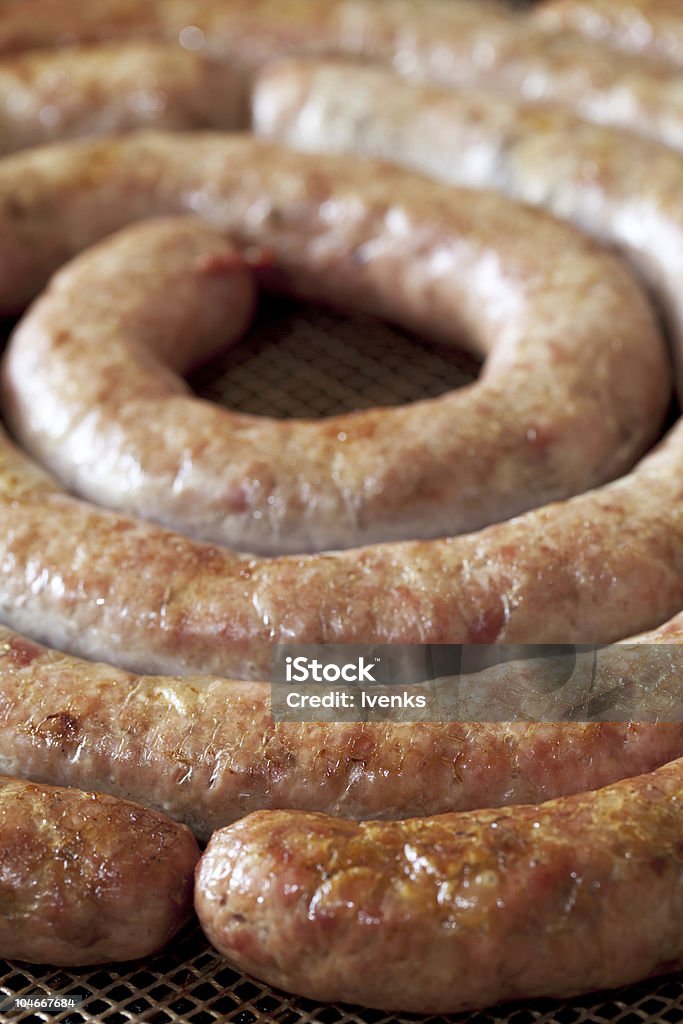 In casa, a spirale, salsiccia di maiale al forno - Foto stock royalty-free di Alimentazione non salutare