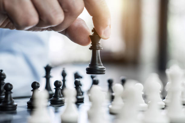 istock Businessman's hand playing chess game to development analysis new strategy plan, business strategy leader and teamwork concept for win and success 1046676846