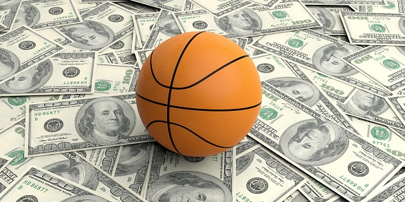 3d rendering basket ball on100 dollars banknotes background