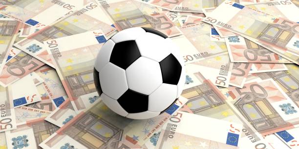 istock 3d rendering soccer ball on 50 euros banknotes 1046682904