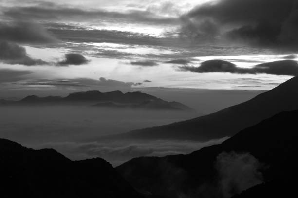 istock Beautiful black and white mountain scenery, sunrise and clouds 1046682988