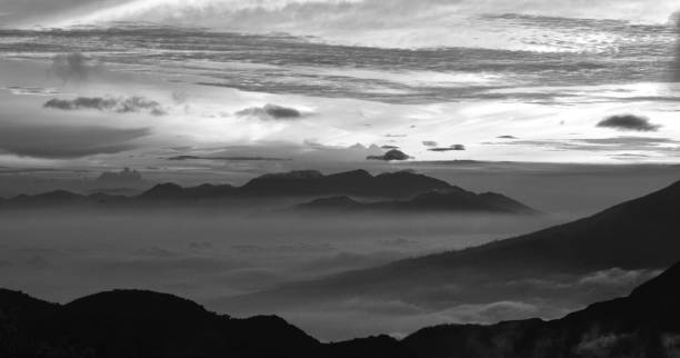 istock Beautiful black and white mountain scenery, sunrise and clouds 1046687962