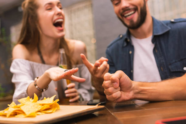 istock Young people feeling excited while playing games together 1046688508