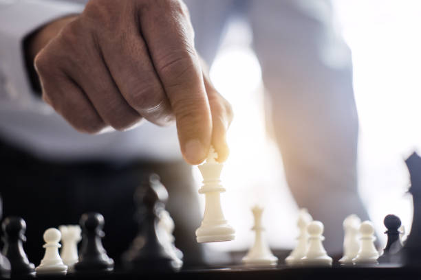 istock Businessman's hand playing chess game to development analysis new strategy plan, business strategy leader and teamwork concept for win and success 1046693938