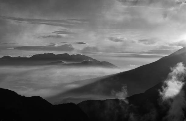istock Beautiful black and white mountain scenery, sunrise and clouds 1046694012
