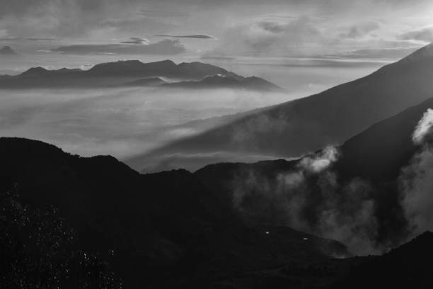 istock Beautiful black and white mountain scenery, sunrise and clouds 1046694014