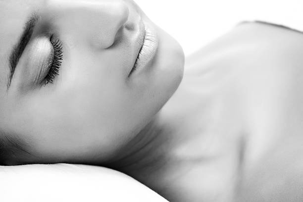 a dreamy middle-aged woman on bed