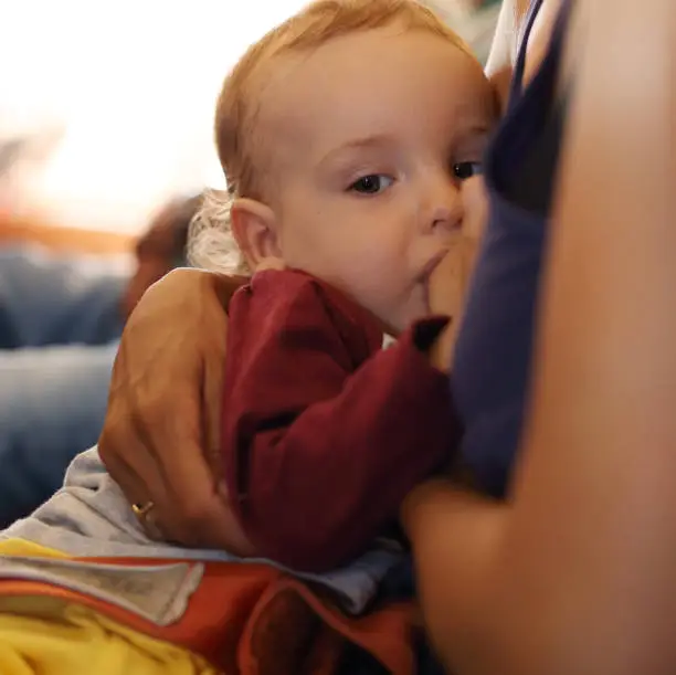 Cute little baby boy, playing at plane