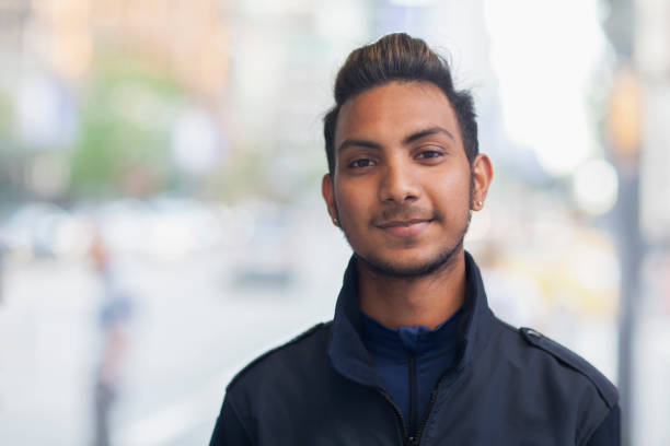 istock Young Indian man street portrait 1046702740