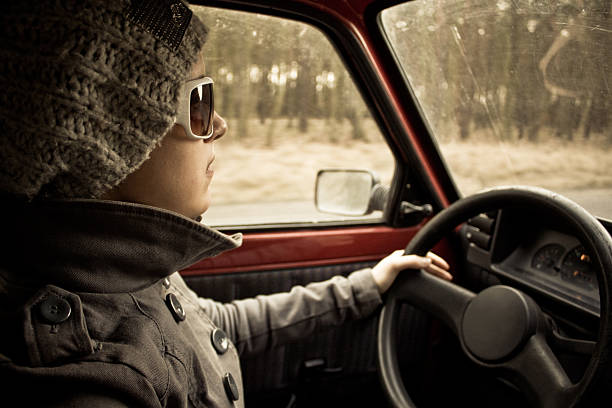 Young girl driving a car stock photo