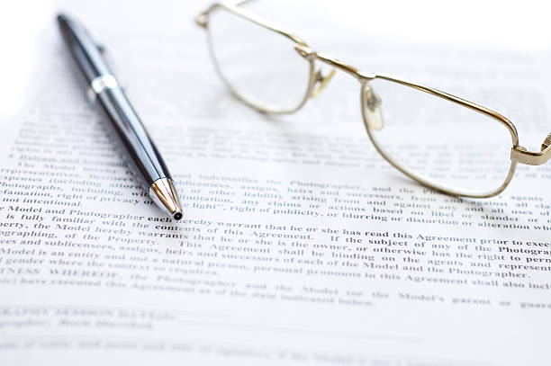 istock Close-up of document, eyeglasses and pen. 104672298