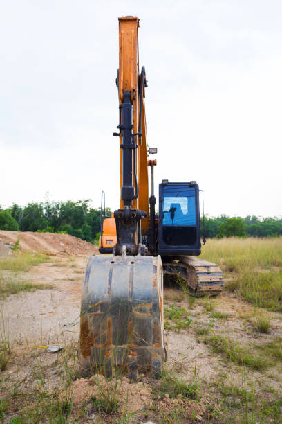 istock Yellow construct transport excavator digging earth outdoors 1046725588