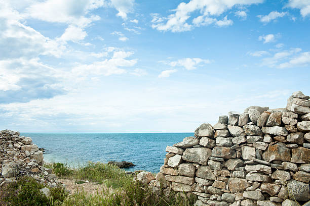 A look thru the wall of an ancient fortress to the mountains outside