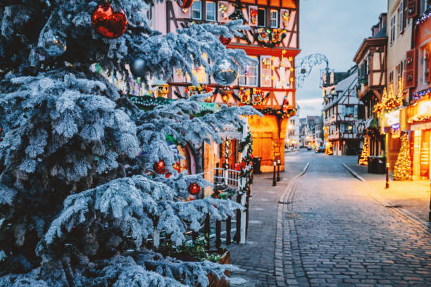 Christmas time in Colmar, Alsace, France Old town decorate magical like a fairy tale in Noel festive season with detail of Christmas tree with red ball ornates at early morning time in Colmar, Alsace, France. colmar stock pictures, royalty-free photos & images