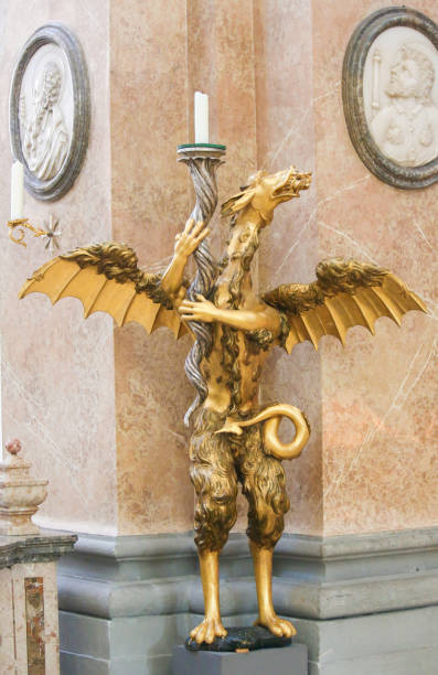 Dragon Candelabrum in St Mang Basilica in Fussen, Bavaria, Germany Bronze Candelabrum in the Shape of a Dragon in the Saint Mang Basilica in Fussen, Bavaria, Germany. st mang stock pictures, royalty-free photos & images