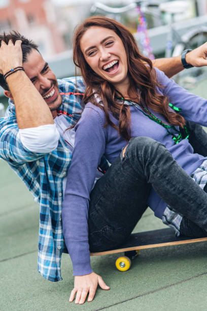 istock Couple on rooftop party 1046738298