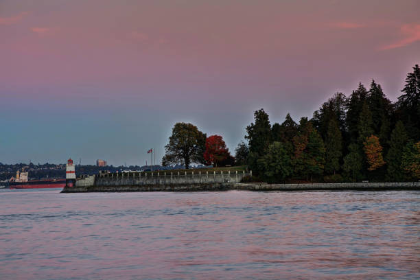 istock lighthouse and park with sunset glow 1046745846