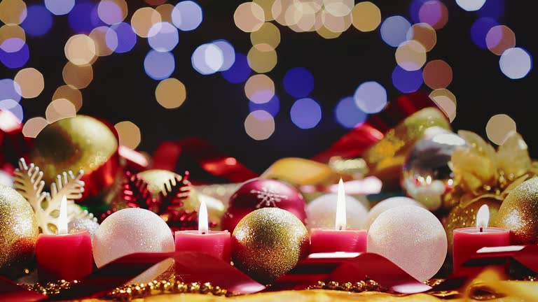 Dolly shot Christmas decoration on table with lights and candles. Holiday backgrounds