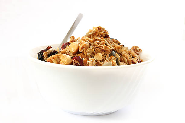 Baked muesli in bowl  muesli stock pictures, royalty-free photos & images