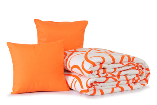 Orange and blue cushion on the gray sofa