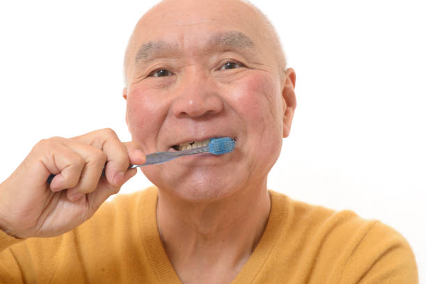 istock Japanese senior brushing teeth 1046760580