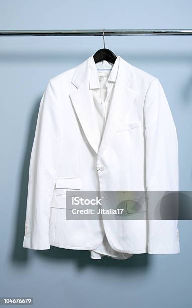 Gods Closet Solitary White Suit Hanging On A Rack Stock Photo - Download Image Now