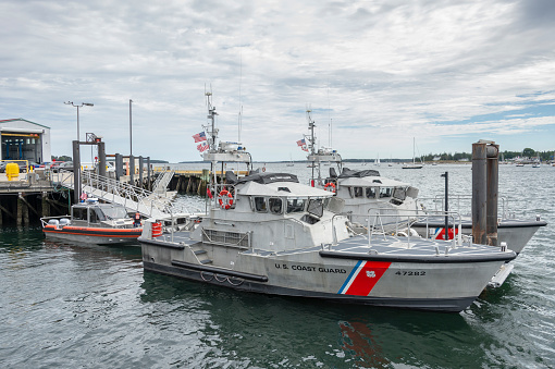 Southwest Harbor, Maine, USA - September 21, 2018: Two 47-foot Motor Life Boats and a Response boat-Small docked at U.S. Coast Guard Station Southwest Harbor