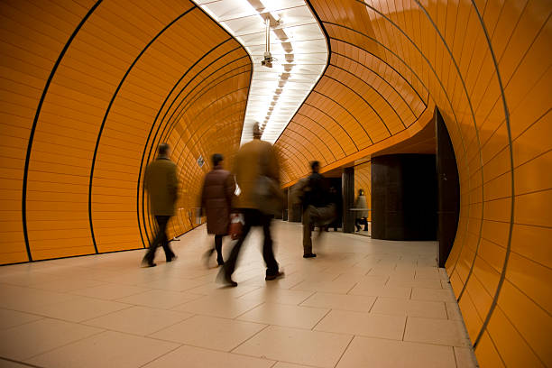 istock commuters motion blurred in orange subway tube 104678670