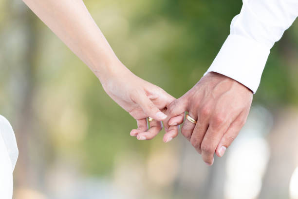 istock Just married couple holding hands 1046787076