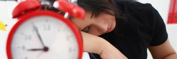 istock Tired and exhausted woman have a lot of work with documents fall asleep 1046787628