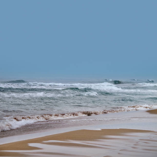 istock Seascape image of empty sea and waves over sky 1046795406
