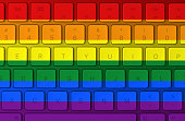 LGBT flag and computer keyboard in the background