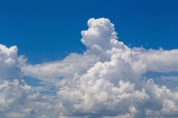 istock White fluffy clouds in the blue sky background 1046798252