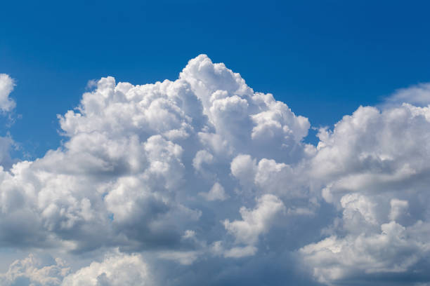 istock White fluffy clouds in the blue sky background 1046798256