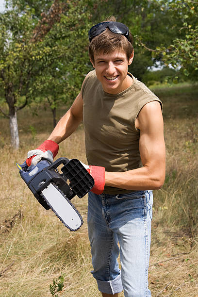 Man with chainsaw stock photo