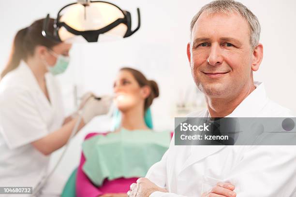 Dentist In His Surgery Stock Photo - Download Image Now - Adult, Color Image, Dental Health